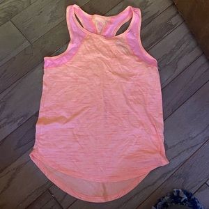 Orange and pink athletic shirt with pink lining.